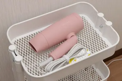 a pink hairdryer and yarn in a white basket at \u30a2\u30f3\u30c9\u30b9\u30c6\u30a4\u6c38\u798f3\u4e01\u76ee301 in Tokyo