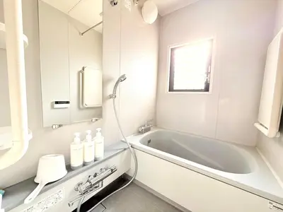 a white bathroom with a tub and a sink at R&J Guest House, 2LDK, 5 min to JR Hirai, Direct to Akihabara and Shinjuku in Tokyo