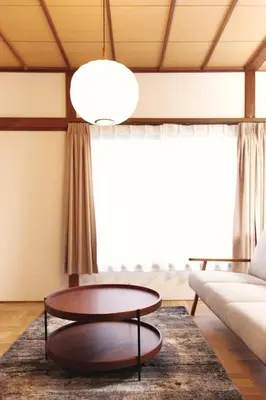 a living room with a coffee table and a couch at North Shinjuku House in Tokyo
