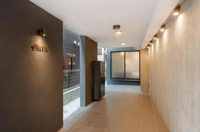 a hallway of a building with a hallway at trias815 \u5e73\u548c\u5cf6201\u53f7\u5ba4 in Tokyo