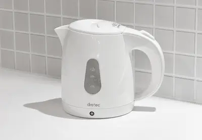 a white electric kettle with a remote control on it at trias815 \u5e73\u548c\u5cf6202\u53f7\u5ba4 in Tokyo