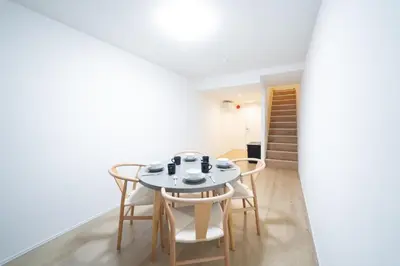 a dining room with a white table and chairs at PRIME Asakusa - Vacation STAY 20543 in Tokyo