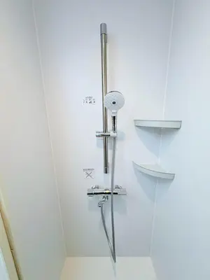 a shower in a bathroom with a glass door at GARDEN HOUSE Tameike-Sanno in Tokyo
