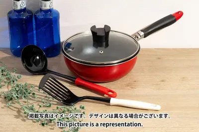 a pot on a table with a spatula and a whisk at Daffitto\u62bc\u4e0aII in Tokyo