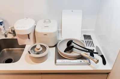 a kitchen counter with a mixer and other kitchen utensils at A2 Shibuya, 2 bedrooms and 1 living room, 7 mins to ST Max 4P \u6e0b\u8c37\u5168\u65b0\u88c5\u4fee \u4e24\u5ba4\u4e00\u5385 \u4ea4\u901a\u4e2d\u5fc3 \u8f66\u7ad97\u5206\u949f \u6700\u59274\u4eba \u76f4\u8fbe\u65b0\u5bbf \u6d89\u8c37 \u8868\u53c2\u9053 \u54c1\u5ddd \u6c60\u888b \u4e0a\u91ce \u4ee3\u4ee3\u6728 \u94f6\u5ea7 \u539f\u5bbf in Tokyo