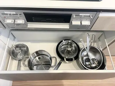four pots and pans sitting inside of a dishwasher at A home that captures the colors and spirit of Japan in Tokyo