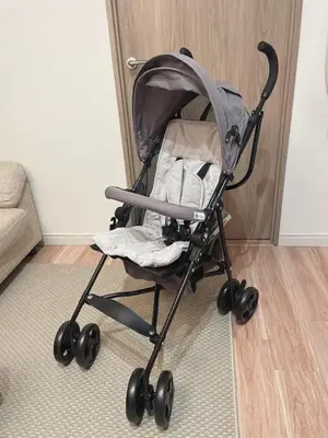 a baby stroller sitting in a living room at A home that captures the colors and spirit of Japan in Tokyo