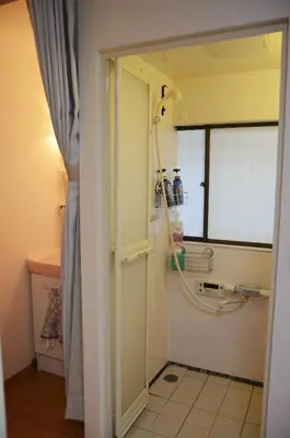 a bathroom with a shower and a sink at Ayaka House Hirai in Tokyo