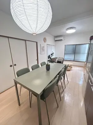 a dining room with a table and chairs at Family Stay & Relaxation -Tokyo East- in Tokyo