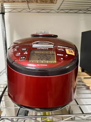 a red slow cooker sitting on top of a shelf at Family Stay & Relaxation -Tokyo East- in Tokyo