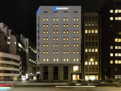 a tall building with a sazon sign on top of it at Villa Fontaine Tokyo Hibiya in Tokyo