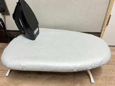 a tv sitting on top of a white ottoman at \u6771\u4eac\u4e0b\u753a\u751f\u6d3b in Tokyo