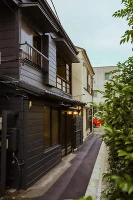an empty street in front of a building at \u6771\u4eac\u4e0b\u753a\u751f\u6d3b in Tokyo