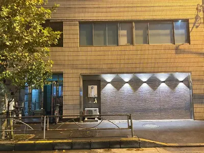 a building with a pay phone in front of it at OmOTeNaShI YAHIRO in Tokyo