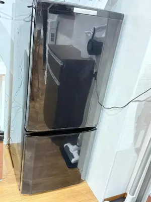 a refrigerator with its door open in a room at OmOTeNaShI YAHIRO in Tokyo