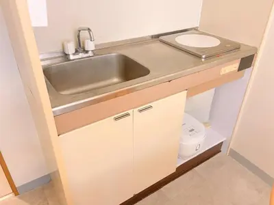 a small kitchen with a sink and a toilet at The perfect place to experience the best of Ikebukuro in Tokyo