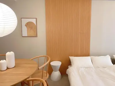 a dining room with a table and a bed at The perfect place to experience the best of Ikebukuro in Tokyo