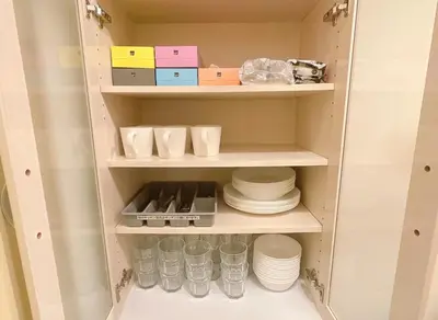 a cupboard filled with plates and cups and dishes at The perfect place to experience the best of Ikebukuro in Tokyo