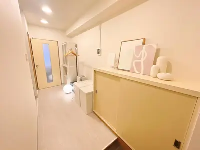 a bathroom with a toilet and a mirror at The perfect place to experience the best of Ikebukuro in Tokyo