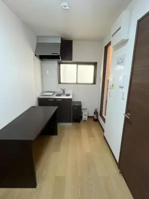 a kitchen with a counter and a sink in a room at Sweet House \u677f\u6a4b in Tokyo
