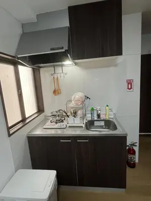a small kitchen with a sink and a stove at Sweet House \u677f\u6a4b in Tokyo
