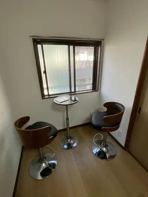 a room with two chairs and a table and a window at Sweet House \u677f\u6a4b in Tokyo