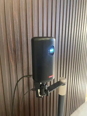 a speaker on a wall with a wooden wall at A cozy hidden gem in Ikebukuro in Tokyo