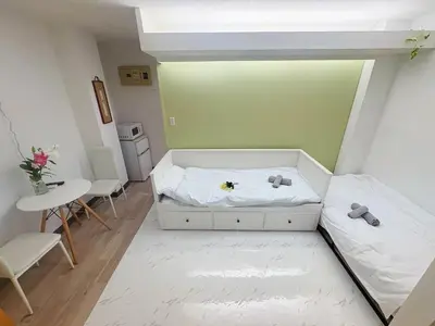 a small room with a bed and a table at Asakusa Sakura-1F in Tokyo