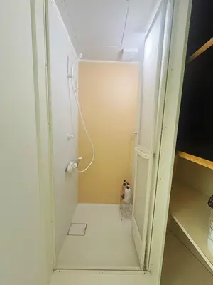 a small bathroom with a shower in a room at Asakusa Sakura-1F in Tokyo