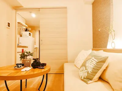 a living room with a couch and a table at Minami Ikebukuro APT Dear Cosmo Ikebukuro subway 6mins in Tokyo
