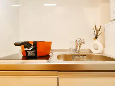 a kitchen counter with a sink and a sink at Minami Ikebukuro APT Dear Cosmo Ikebukuro subway 6mins in Tokyo