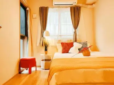 a bedroom with a bed and a window at Minami Ikebukuro APT Dear Cosmo Ikebukuro subway 6mins in Tokyo