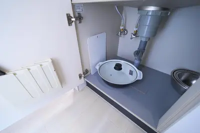 a small bathroom with a sink and a toilet at Lavi'n Asakusa ラヴィン浅草 in Tokyo