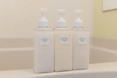 three white bottles sitting on top of a sink at \u30a2\u30f3\u30c9\u30b9\u30c6\u30a4\u5927\u68ee\u4e2d102 in Tokyo