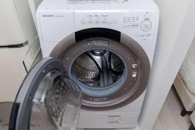 a washing machine with its door open in a room at \u30a2\u30f3\u30c9\u30b9\u30c6\u30a4\u5927\u68ee\u4e2d102 in Tokyo