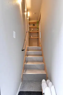 a staircase in a room with a stair case at -Grandir Shibuya- 7-minute walk to Shibuya Station in Tokyo