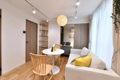 a living room with a couch and a table at -Grandir Shibuya- 7-minute walk to Shibuya Station in Tokyo