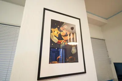 a picture of mickey mouse on a wall at Yotsugi House \u56db\u30c4\u6728\u30cf\u30a6\u30b9 in Tokyo