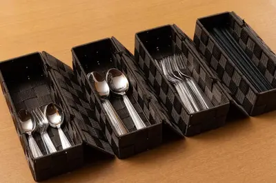 a black box with forks and spoons in it at \u30a2\u30f3\u30c9\u30b9\u30c6\u30a4\u9752\u62383\u4e01\u76ee in Tokyo