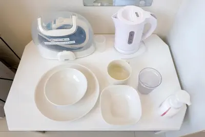 a white counter with a blender and cups on it at monthly Nano Kamiochiai in Tokyo