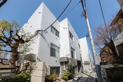a white building on a street at monthly Nano Kamiochiai in Tokyo