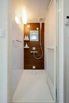 a bathroom with a shower and a sink at monthly Nano Kamiochiai in Tokyo