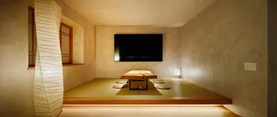 a room with a table and a tv on the wall at Yohaku Tokyo in Tokyo
