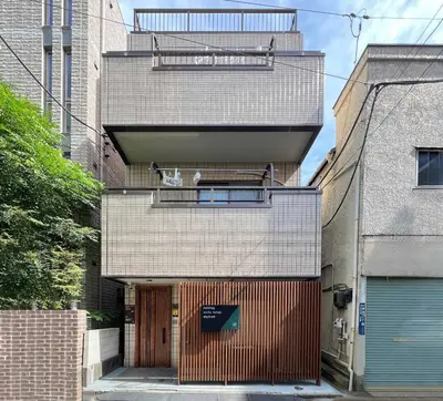 an external view of a building with a door at nestay suite tokyo skytree in Tokyo