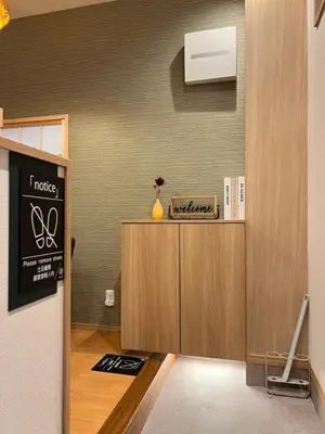 a room with a podium with a sign on the wall at nestay suite tokyo skytree in Tokyo