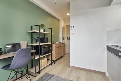 a kitchen with a desk and a chair in a room at CraftFlat Komagome 502, a compact studio at excellent location in Tokyo