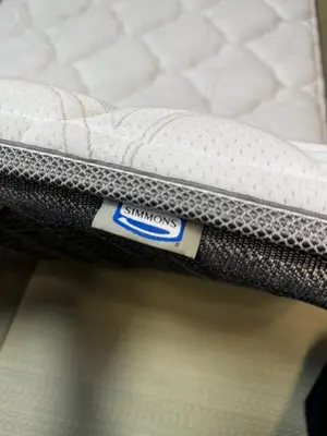 a close up of a mattress with a sticker on it at Motosakura 301, direct access to Narita and Haneda, 2 beds, 5 train lines, elevator, free bicycle rental, luxury double bed in Tokyo