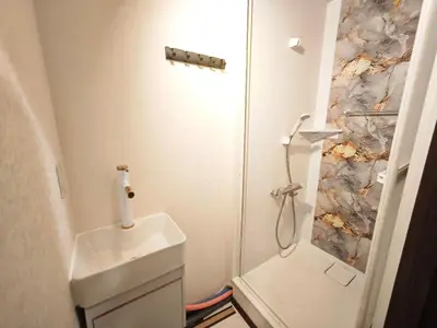a small bathroom with a toilet and a shower at ZYZ Higashijūjō 101 KI0482 in Tokyo