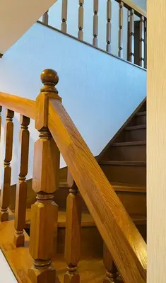 a wooden staircase with wooden railings and a stair case at New Tokyo Asakusa Area Emi House in Tokyo