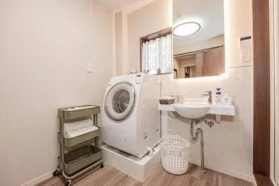 a bathroom with a washing machine and a sink at KTV Party House 3min to Itabashi Station Traditional Street Stay in Tokyo